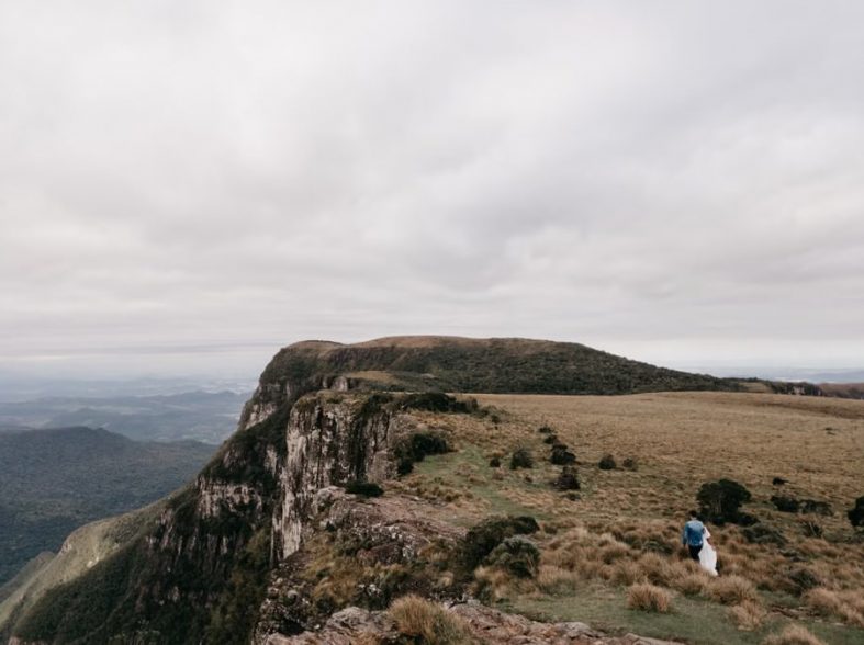 Dramatic vista of a mountain cliff with an overcast sky in Cambará do Sul, perfect for travel imagery.